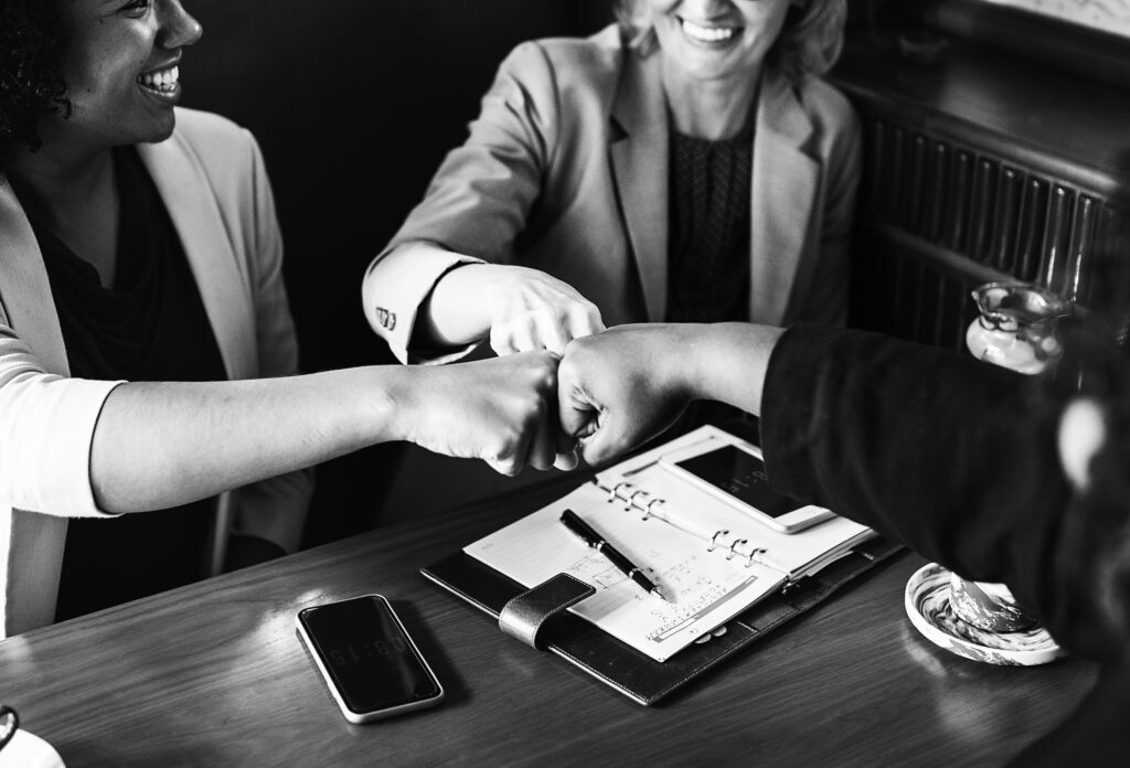 Businesswomen in a fist bump
